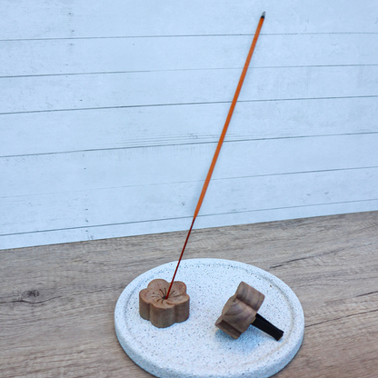 Plantish wooden flower diffuser shown from behind and the side with the black vent clip attached; incense not included