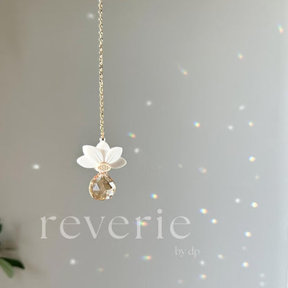 Reverie by DP gold-tone white lotus crystal car charm