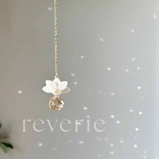 Reverie by DP gold-tone white lotus crystal car charm